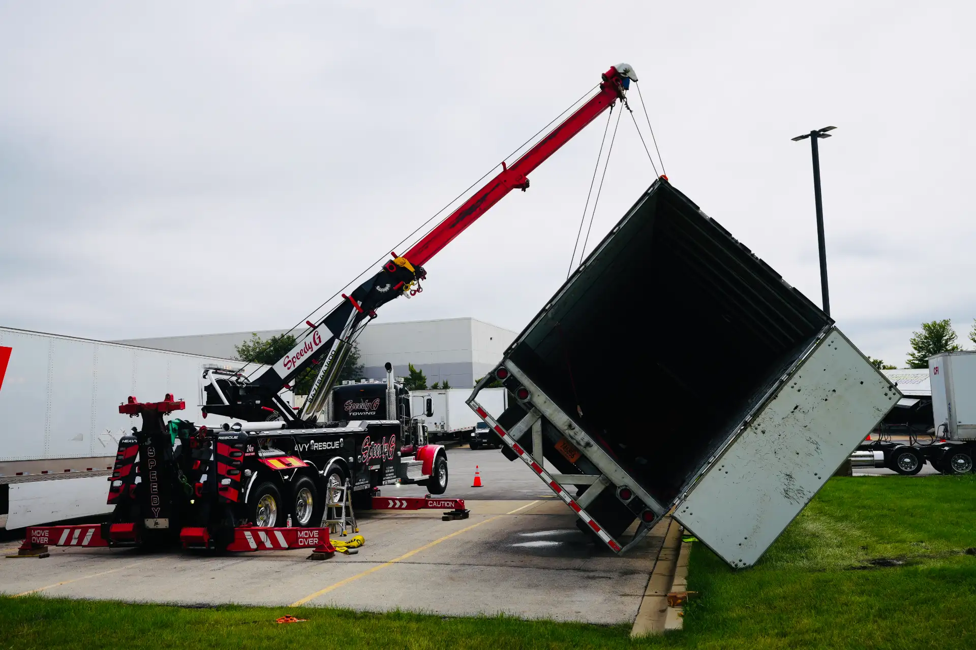 heavy-duty-rotator-truck-uprighting-overturned-semi-trailer