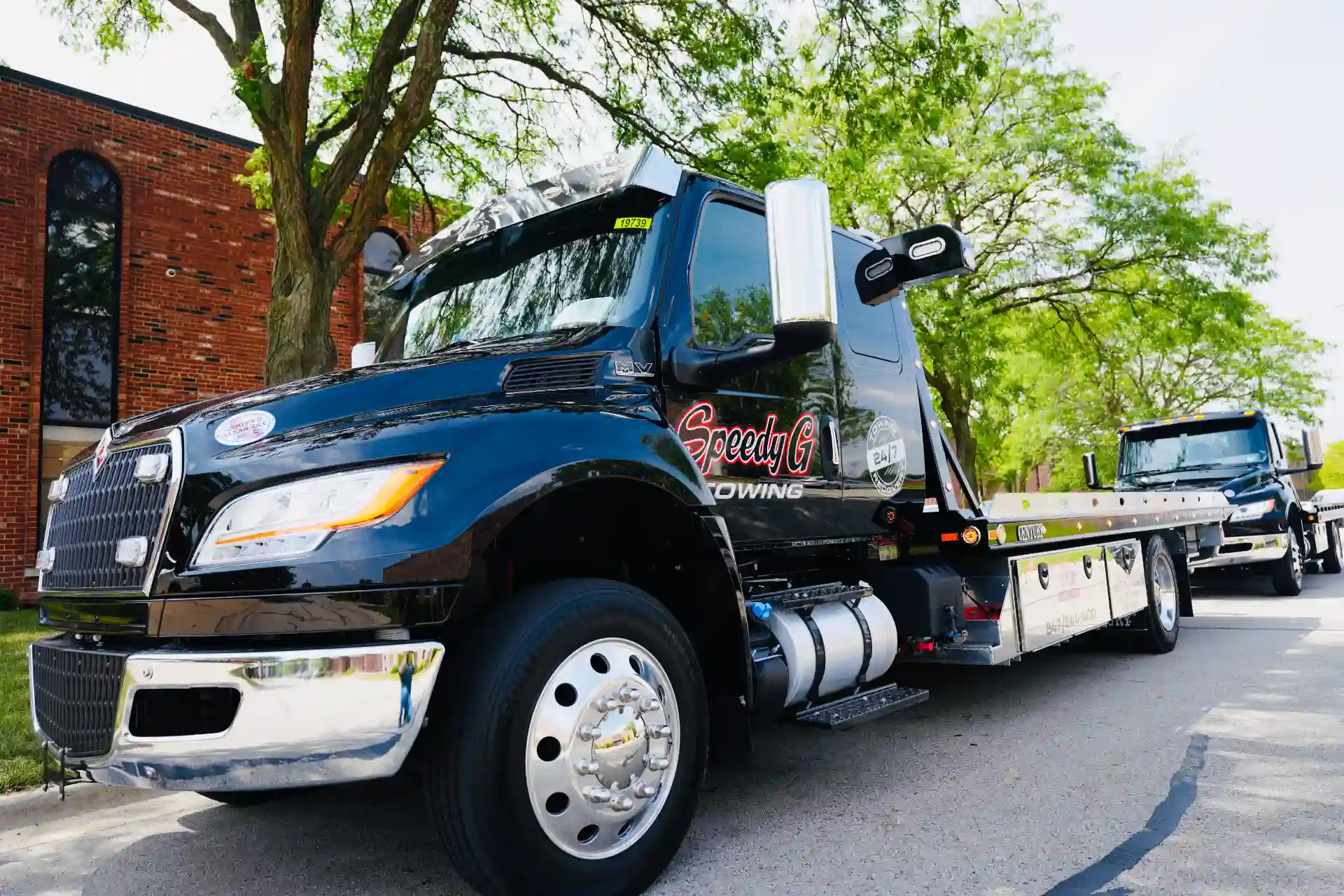 speedy-g-towing-black-flatbed-truck-service-chicagoland