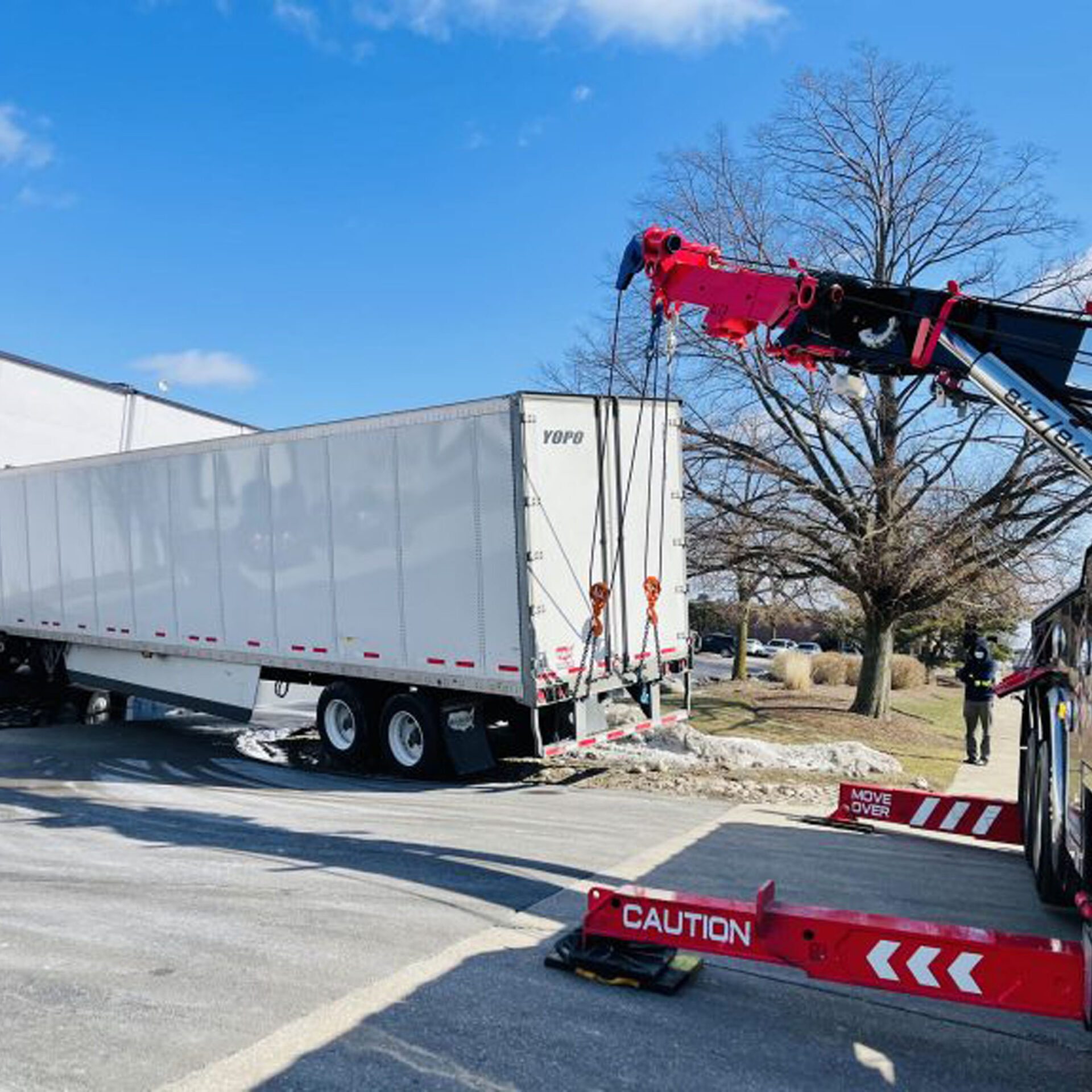 Speedy G truck rescuing a trailer from a snow bank
