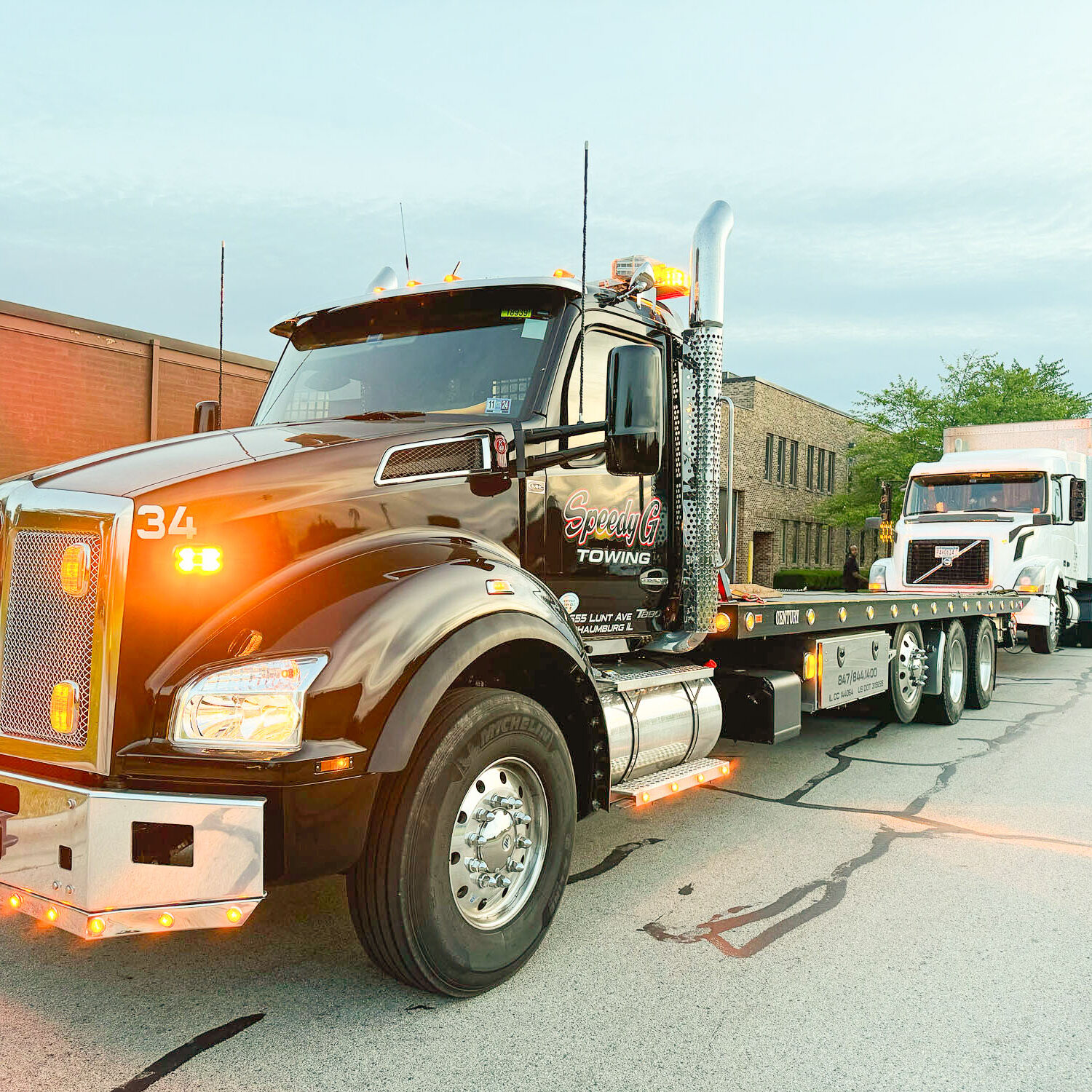 Speedy G truck towing an 18 wheel truck