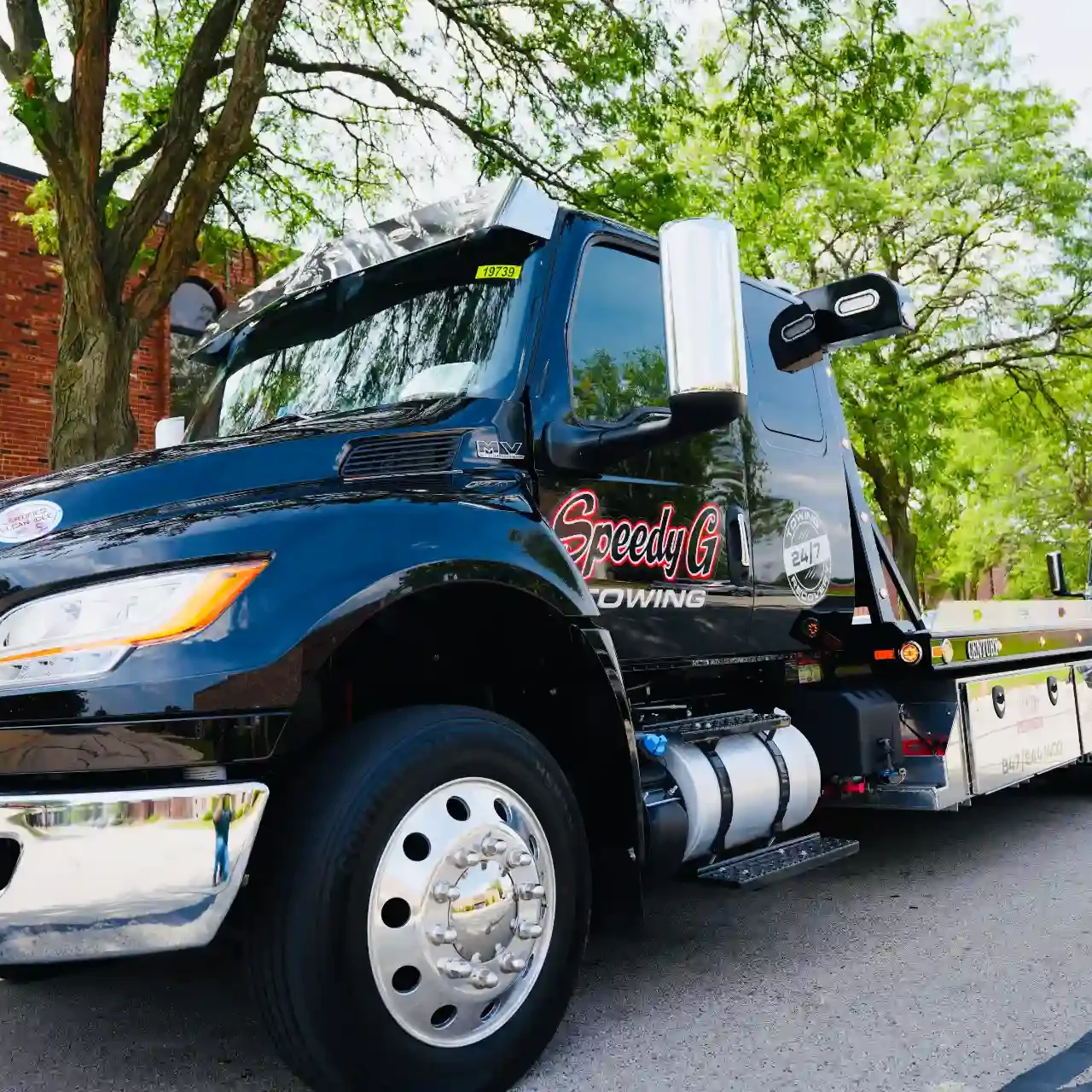speedy-g-towing-black-flatbed-truck-service-chicagoland